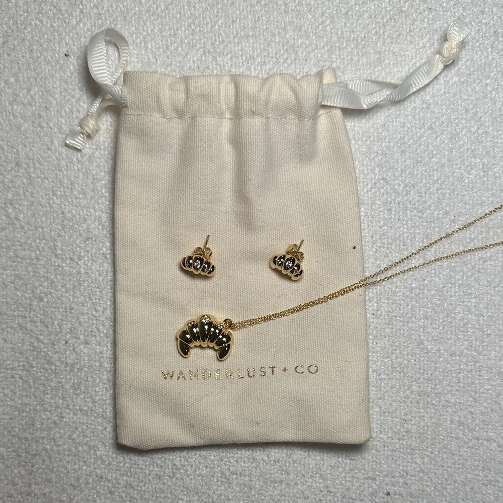 Wanderlust + Co Gold Crossaint Pendant Necklace with Matching Studs